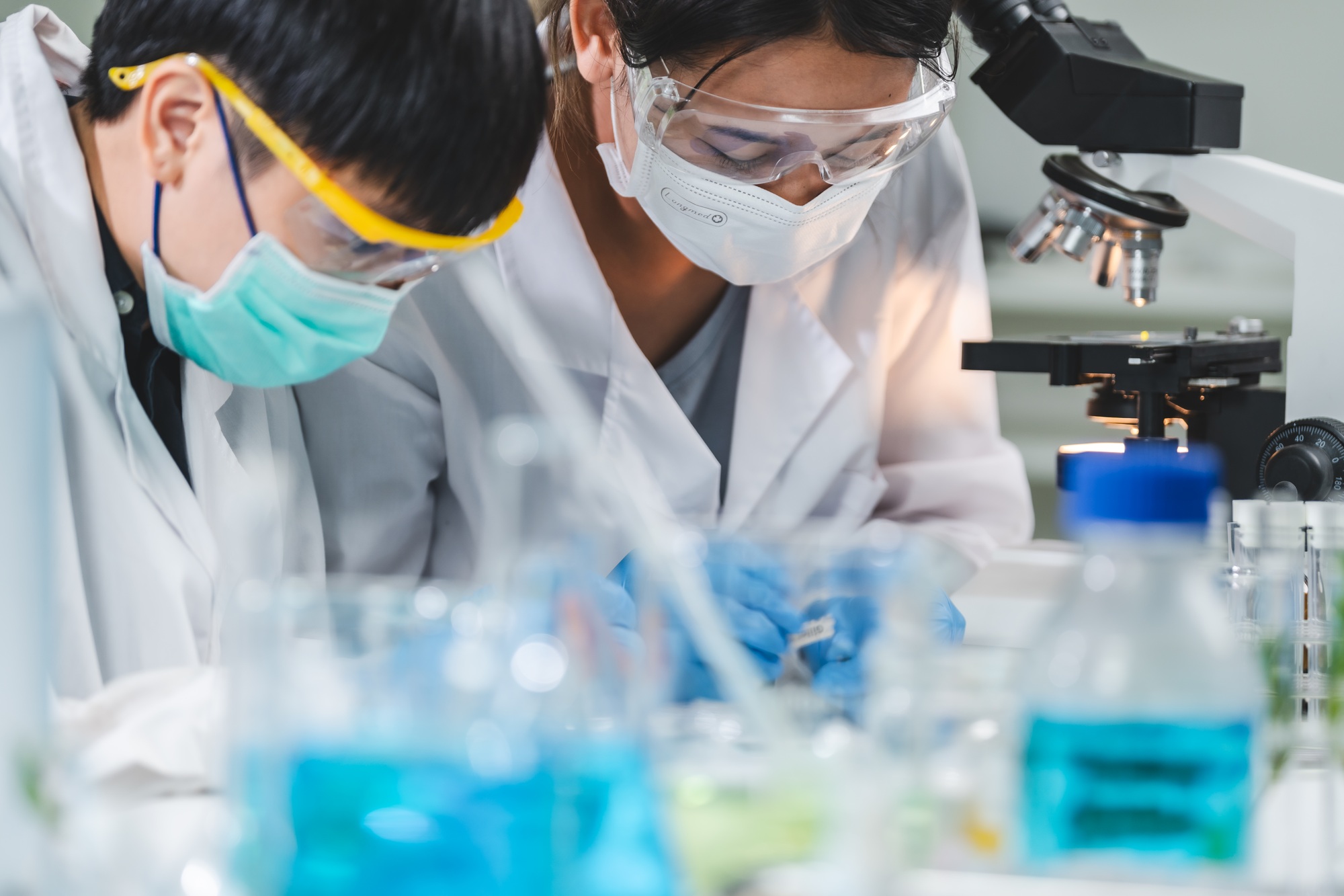researcher working in laboratory for medicals science research using scientific equipment technology